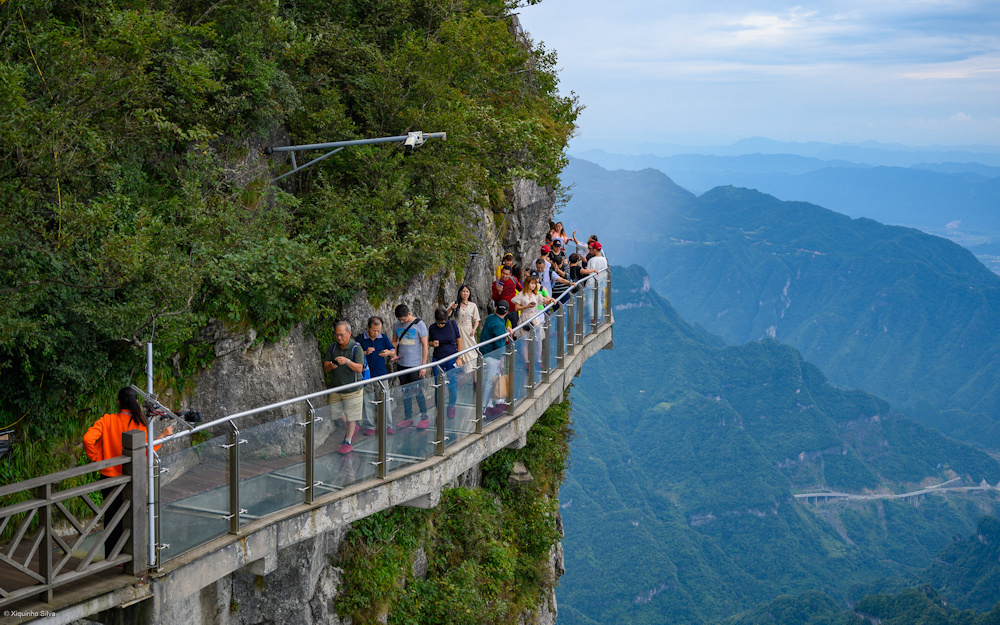Glass skywalk wrapping the cliff edge of Tianmen Mountain